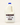 One gallon jug of Hooter Flats raw whole milk on a plain studio background